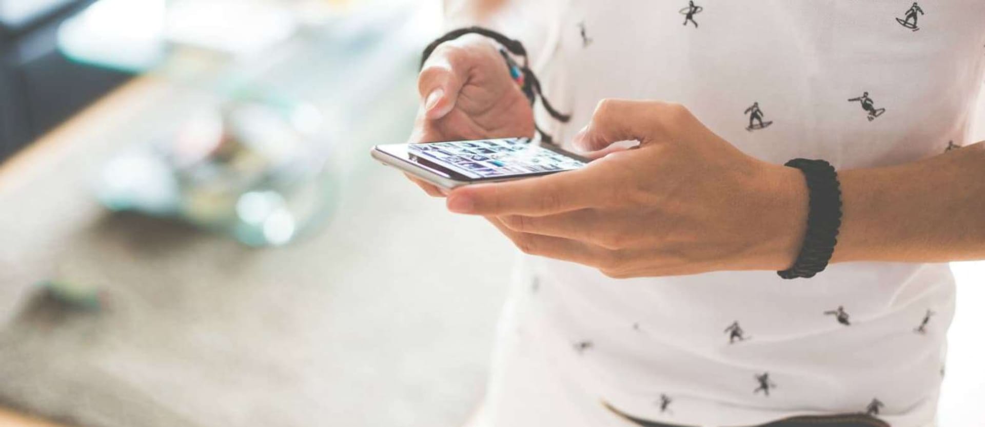 man holding a mobile phone with apps