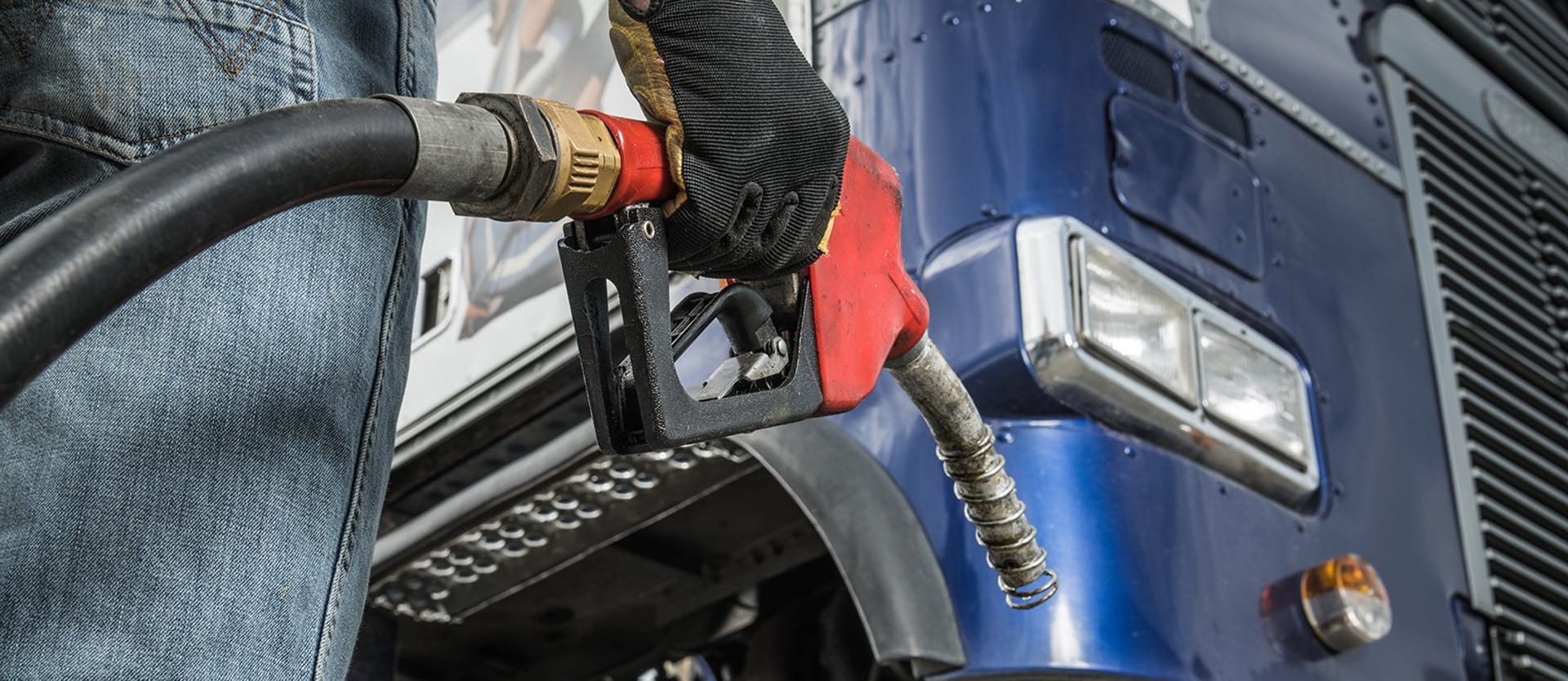 Trucker in Front of His Truck Preparing For Diesel Fueling