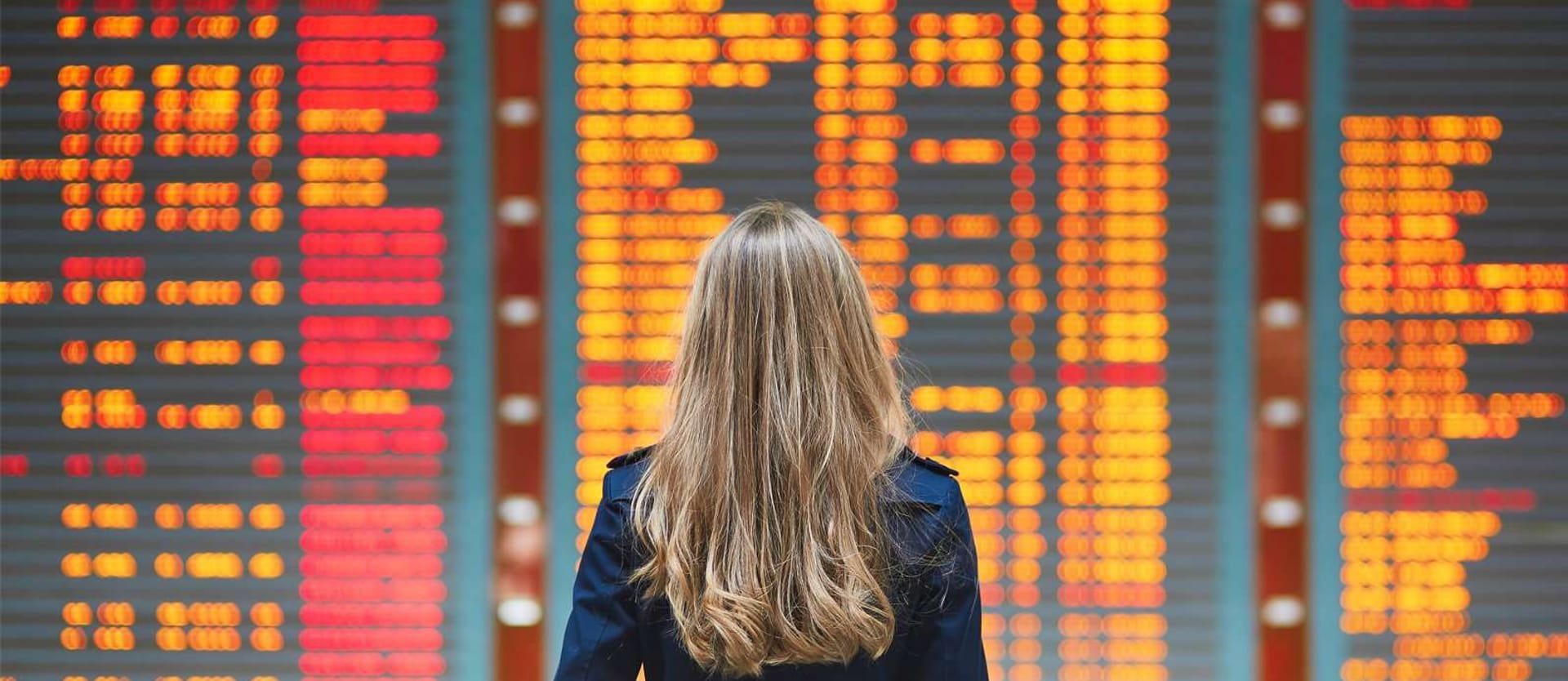 woman looks at boarding infromation