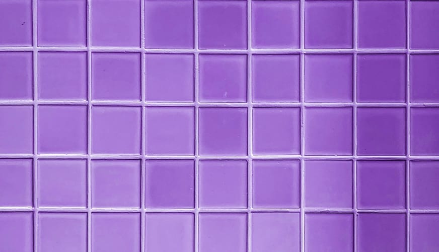 Сolorful bright violet purple tiles square mosaictiles wall of the bathroom