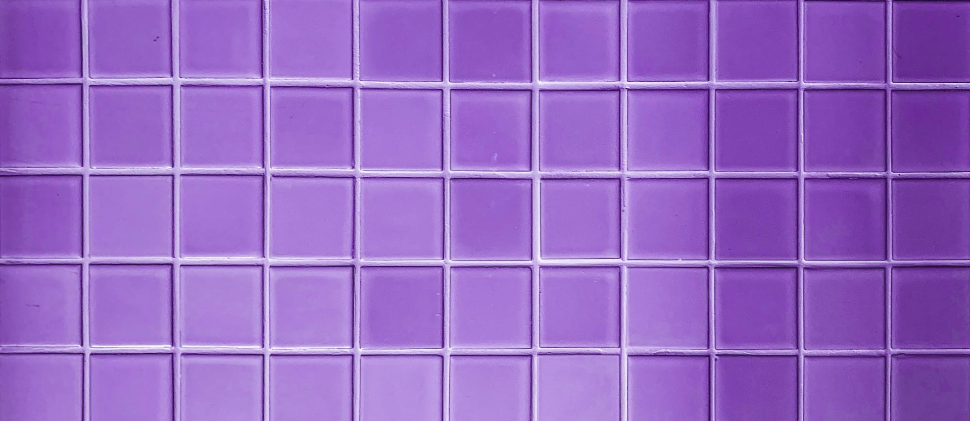 Сolorful bright violet purple tiles square mosaictiles wall of the bathroom